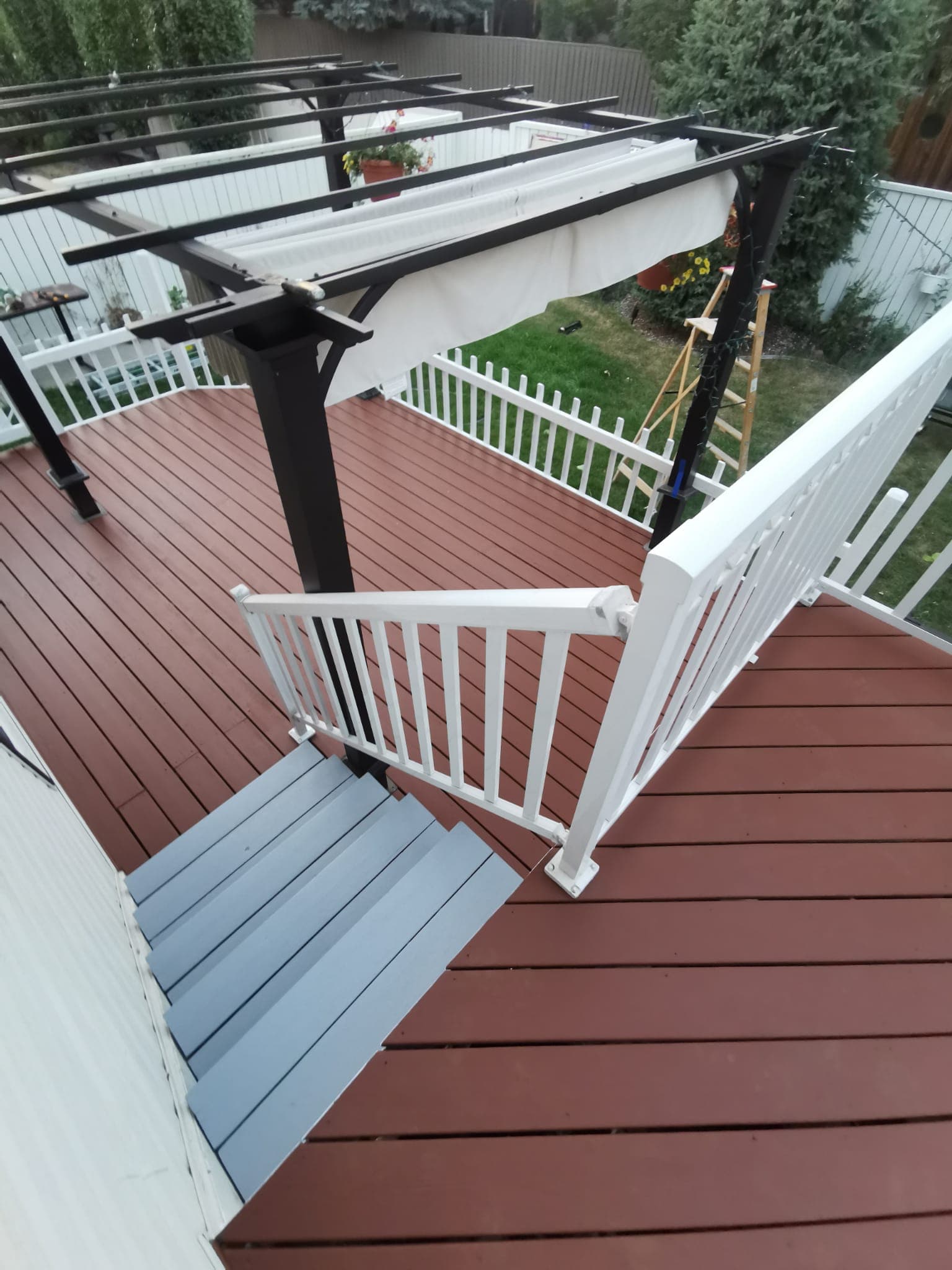 Finished deck painting by Calgary exterior painters from Alberta Colour Painting