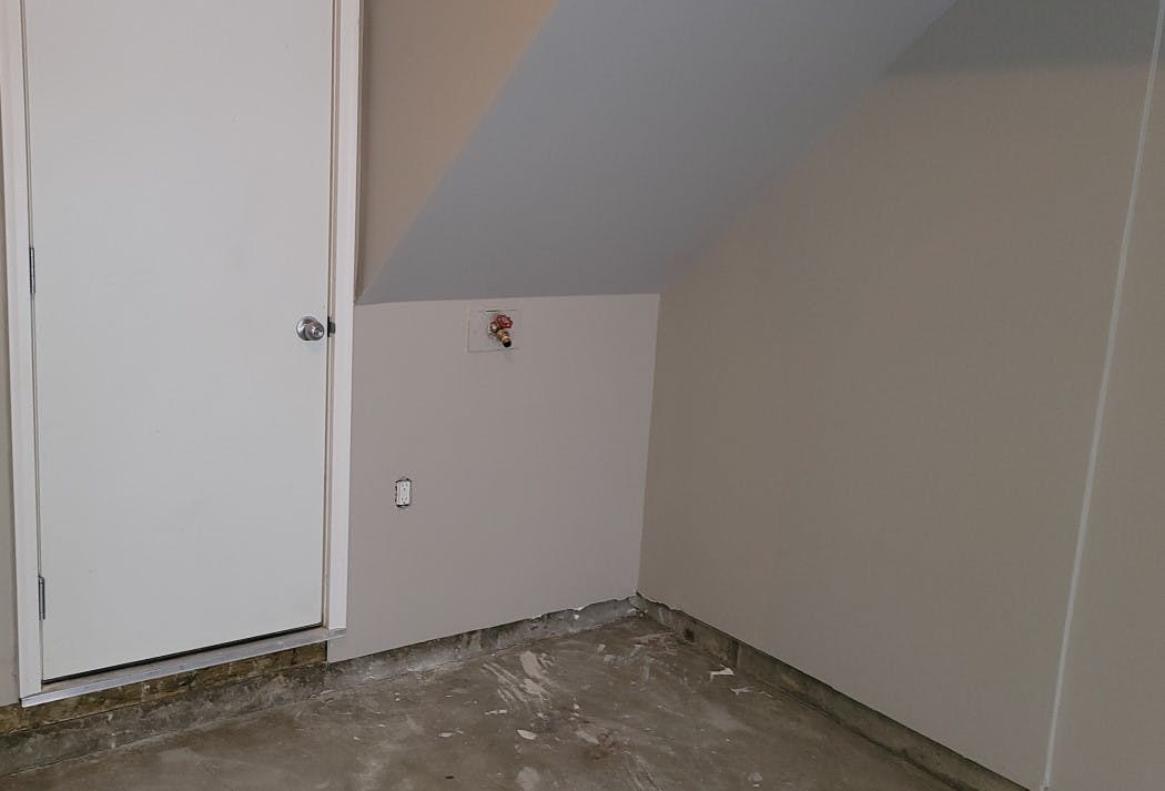 Calgary garage drywall repair -  A 2 feet by 3 feet hole after fixed
